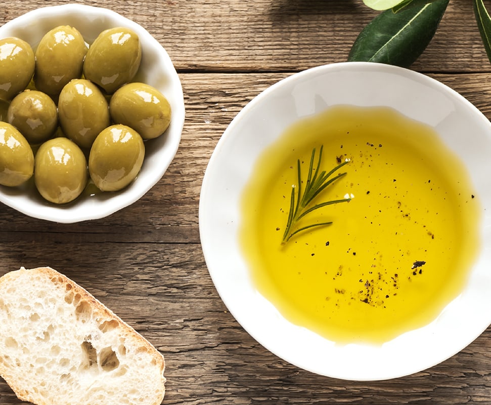 olive oil with olives and herbs
